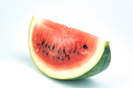 A cut watermelon placed on a white backgroundの写真素材