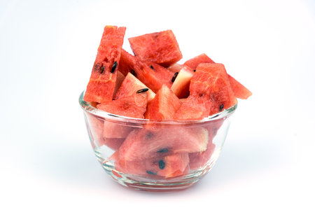 Cut watermelon placed on a white backgroundの写真素材