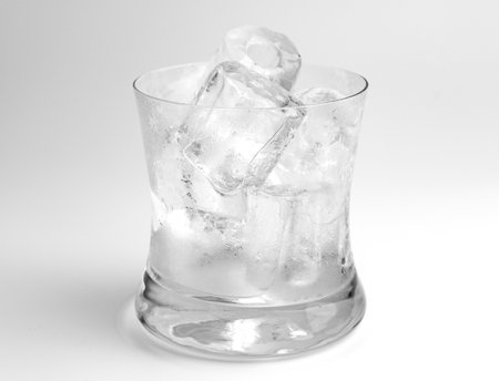 Glass with ice on a white backgroundの写真素材