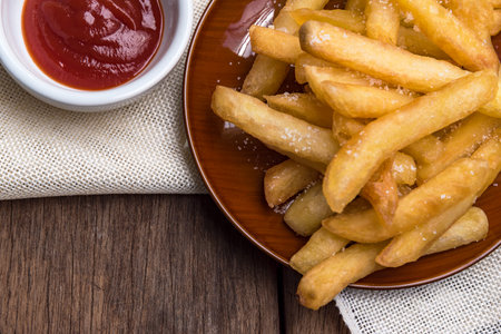 The french fries are placed in a cup with ketchup.の写真素材