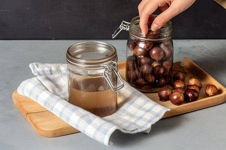 Preparing chestnut liquid soap, cutting buckeye and putting it into a jar with water, alternative homemade detergent for washing clothesの素材