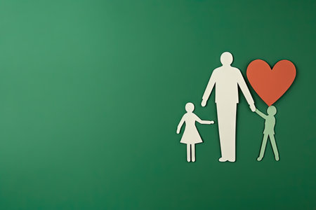 Parents with one child holding hands, paper cut out, heart over the family, copy space, green colored backgroundの素材