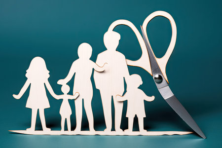 Divored parents, custody battle for the children, scissors cut the family, paper cut out, conflict in relationship, broken marriage conceptの素材