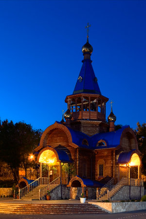 Temple of the Assumption of the Blessed Virgin. Wooden temple in the city of Togliatti on the Volga River. The golden dome.の写真素材