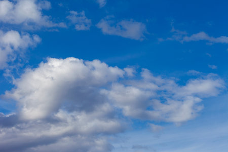 Sky with clouds and sun.  Fluffy soft cumulus.の写真素材