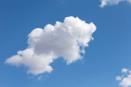 Sky with clouds and sun.  Fluffy soft cumulus.の写真素材