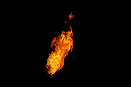 Fire, flame on a black background. Fire for advertising. An unusual game of bright red and yellow...