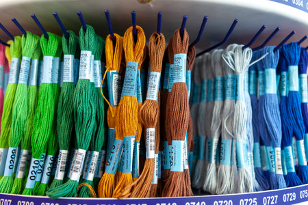 TOLYATTI, RUSSIA, JUNE 09, 2018: Rocks with colorful mouline in store. Color mouline threads. Palette of mulina threads for embroidery cross and smooth. Front view.のeditorial素材