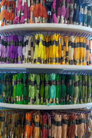 TOLYATTI, RUSSIA, JUNE 09, 2018: Rocks with colorful mouline in store. Color mouline threads. Palette of mulina threads for embroidery cross and smooth. Front view.のeditorial素材