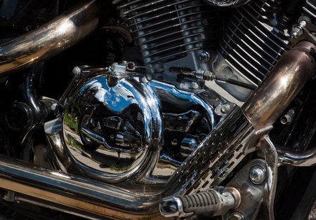 TOLYATTI, RUSSIA, JUNE 25, 2005: motorcycle show of bikers. Shiny chrome motorcycle engine block Chopper.のeditorial素材