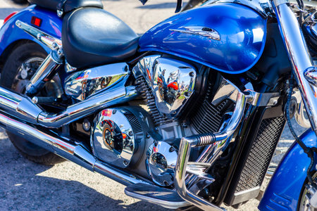 TOLYATTI, RUSSIA, MAY 09, 2018: show of bikers dedicated to Victory Day. Shiny chrome motorcycle engine block Yamaha, Honda. Reflection of people in a chrome plated surface.のeditorial素材