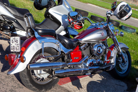 TOLYATTI, RUSSIA, MAY 09, 2018: Biker show dedicated to Victory Day. Yamaha motorbike. Red and silver motorcycle with chrome pipes.のeditorial素材