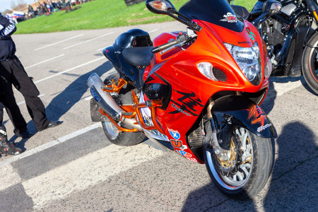 TOLYATTI, RUSSIA, MAY 09, 2018: Biker show dedicated to Victory Day. Orange glossy Suzuki motorbike. Motorcycle with stickersのeditorial素材
