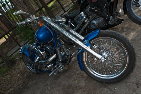 TOLYATTI, RUSSIA, JULY 03, 2010: biker show. Motorcycle chopper. Blue motorcycle hand assembly.のeditorial素材