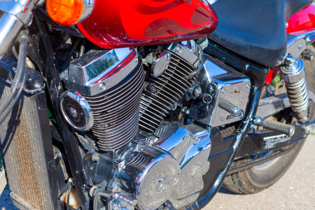 TOLYATTI, RUSSIA, MAY 09, 2018: show of bikers dedicated to Victory Day. Shiny chrome motorcycle engine block Yamaha, Honda. Reflection of people in a chrome plated surface.のeditorial素材