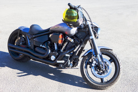 TOLYATTI, RUSSIA, MAY 09, 2018: Biker show dedicated to Victory Day. Yamaha warrior. Black matte motorcycle with helmet on handle.のeditorial素材