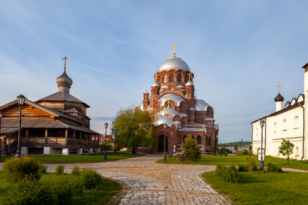 Sviyazhsk, Russia, June 04, 2018: Cathedral in the name of the icon of the Mother of God. Wooden temple on the island of Sviyazhsk. Gray domes, golden crosses.のeditorial素材