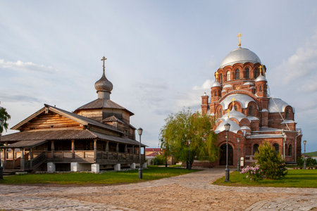 Sviyazhsk, Russia, June 04, 2018: Cathedral in the name of the icon of the Mother of God. Wooden temple on the island of Sviyazhsk. Gray domes, golden crosses.のeditorial素材