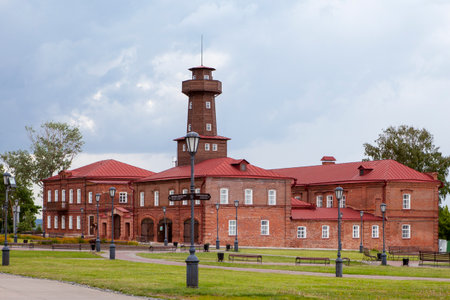 Ancient building of Sviyazhsk self-government. Red brick building with iron roof. Tall wooden tower.のeditorial素材