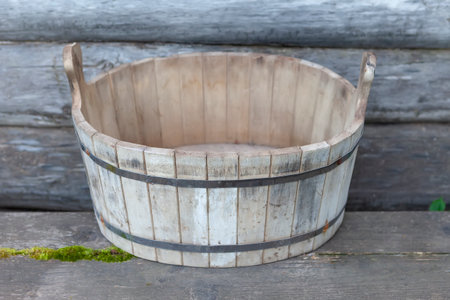 Wooden tub for Russian bath. Wooden vessel for water, liquid. Craft, handicraft, village.の写真素材