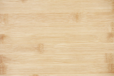 Board made of natural bamboo wood. Textures pattern background in light yellow cream beige brown color. Live shades of a gentle surface.の写真素材
