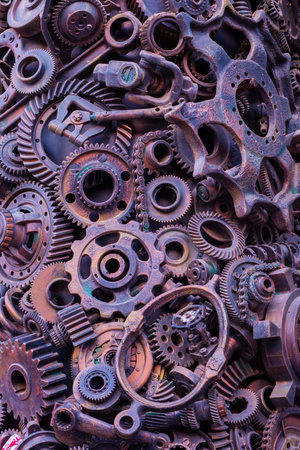 Steampunk background, machine parts, large gears and chains from machines and tractors. Old rusty machine parts. Springs, bearings, pistons, crankshafts, camshafts.の写真素材
