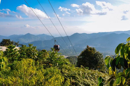 Cable cars are climbing the mountainの写真素材