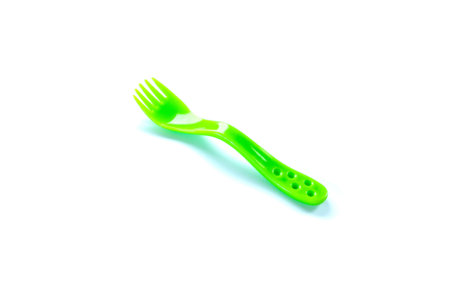 childrens green plastic plug isolated on white background