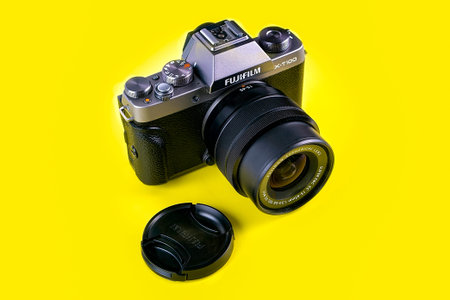 Novokuznetsk,Russia-07.03.2021,Fujifilm X-T100 Entry-Level Mirrorless camera isolated on a yellow...
