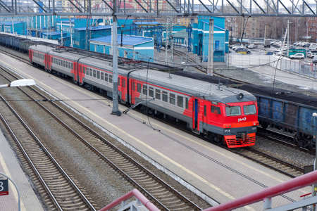 Novokuznetsk,Russia-30.03.2021.an electric train of 4 cars stands on the platform of the city railway station.のeditorial素材