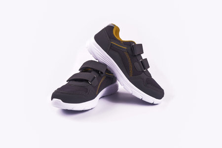 children's gray cross-stitch shoes, isolated on a white background.の写真素材