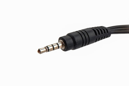black 3.5 mm jack audio cable isolated on white background.