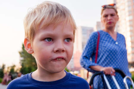 the mother looks reproachfully at the guilty boy.the concept of child education.の写真素材