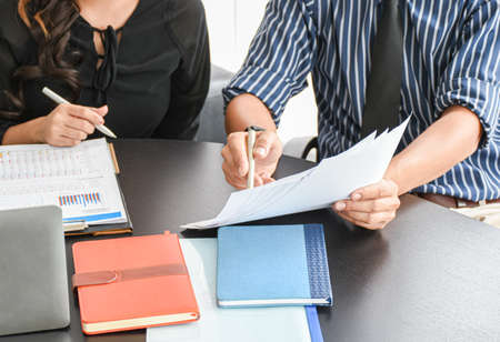 The boss and partner women checking document the resume orr the recruitment paper on desk office. Business success background view.の写真素材
