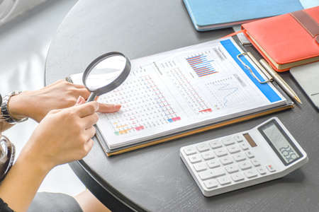 Top view of Business women checking and analyzing documents on the table. Concept business. Resume.の写真素材
