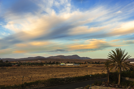Beautiful colors and clouds in the sky just after the sunrise in Caleta de Fuste, Fuerteventuraの写真素材