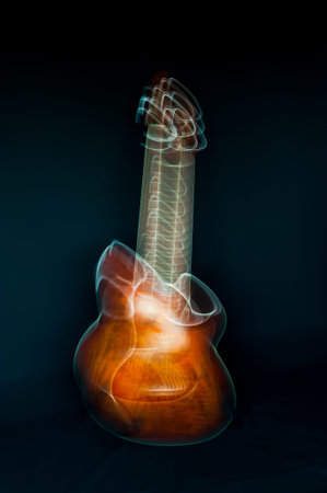 Colorful abstract shape of a guitar made from lines and waves on dark blue background