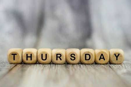 The word Thursday on wooden cubes. Weekday conceptの写真素材