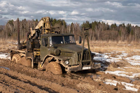 The truck stuck in the mud in the spring in a fieldの写真素材