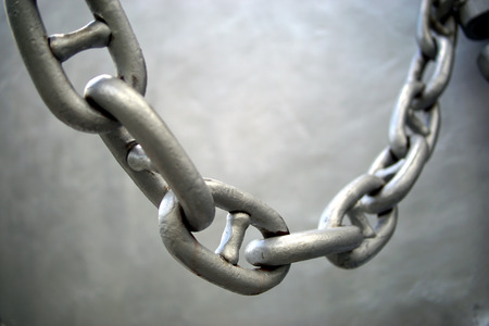 Thick metal chain of some industrial machinery closeupの写真素材