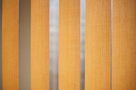 Beige vertical blinds closeup for the backgroundの写真素材