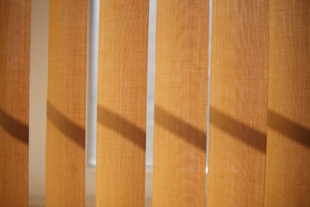 Beige vertical blinds closeup for the backgroundの写真素材