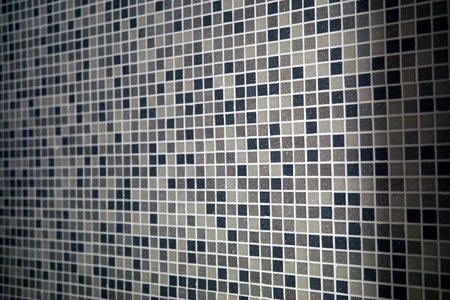 Mosaic tiles in grey shades for background.