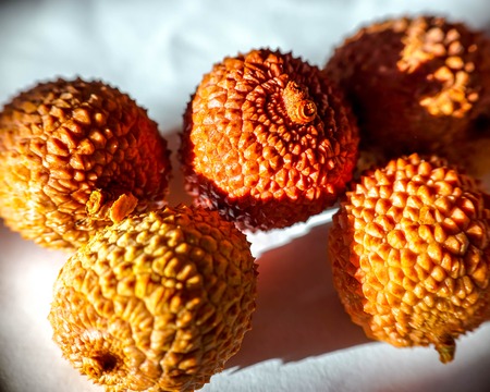 Litchi chinensis. Lychee fruit closeup in the shell, peeled and with pit.の写真素材