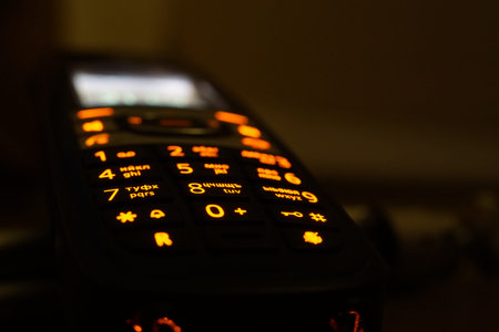 Glowing phone buttons in the dark closeup photo