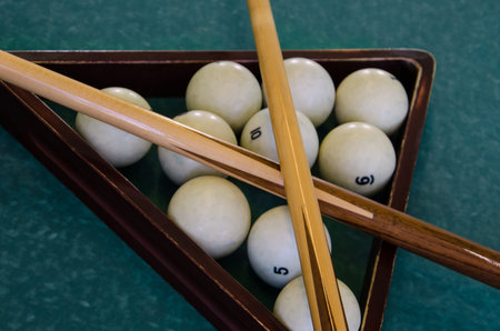 Balls for billiards pool snooker are on green table, preparation for game
