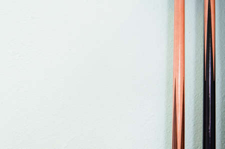 billiard cue sticks on white backgroundの写真素材