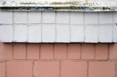 Background of old vintage dirty brick wall with peeling plaster, textureの写真素材