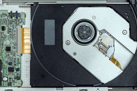Open optical disc drive on a modern laptop computer without disc.の写真素材
