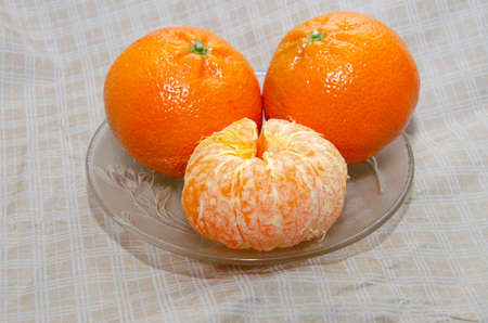 Ripe orange fresh mandarin, mandarin slices, isolated on white backgroundの写真素材